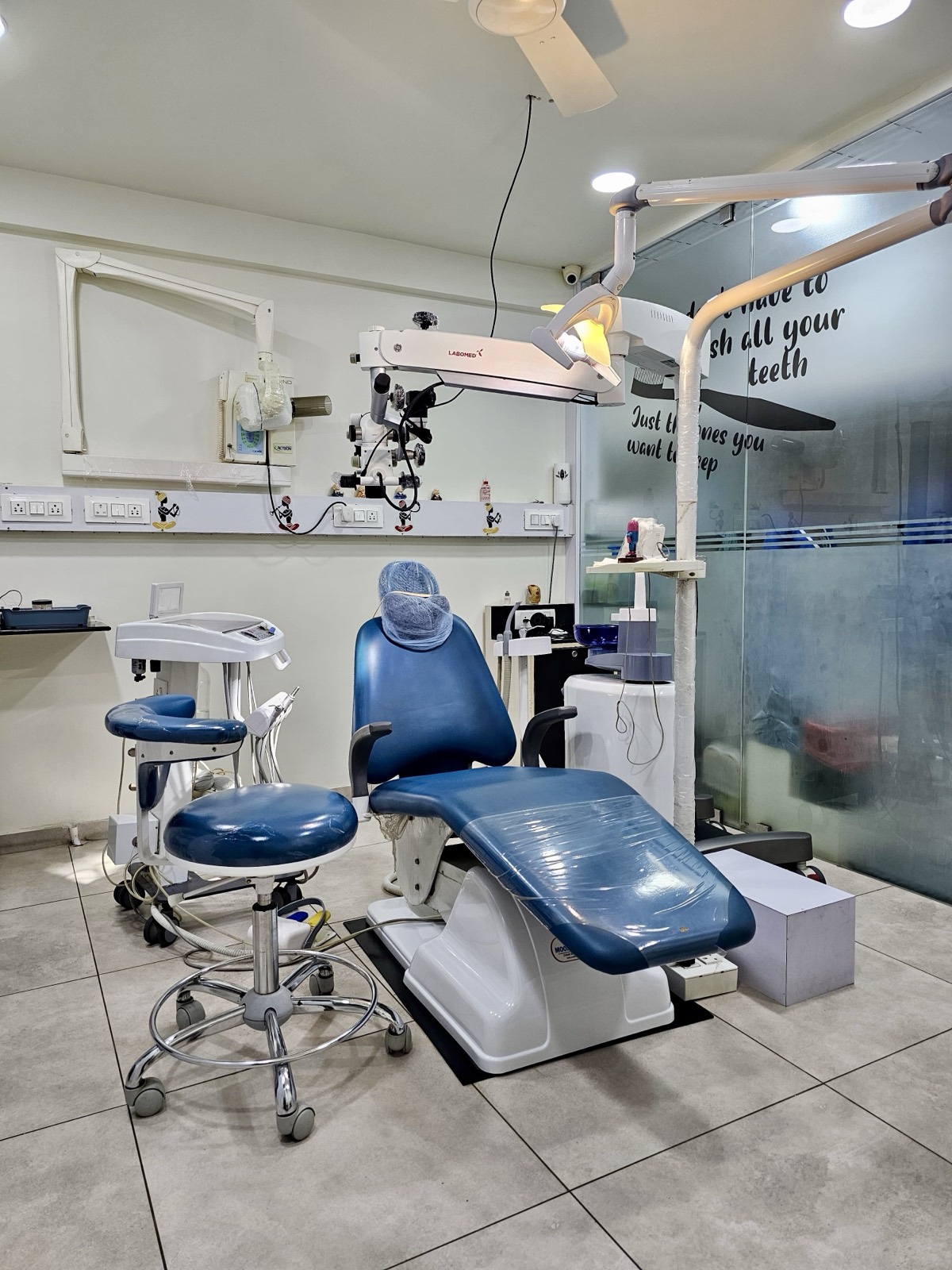 Main operatory with dental chair and operating microscope