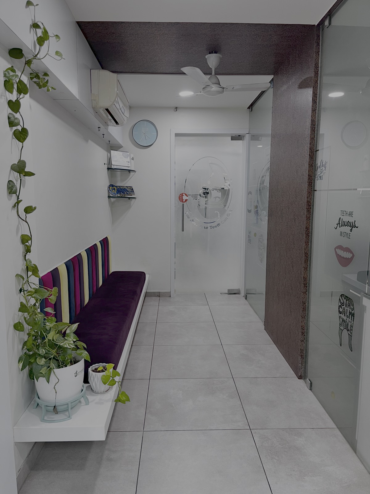 Reception and waiting area with seating and plants